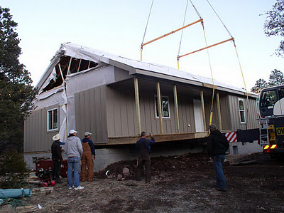 Photo of a work crew delivering a modular home